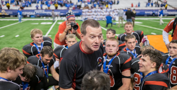 football coach talking to team